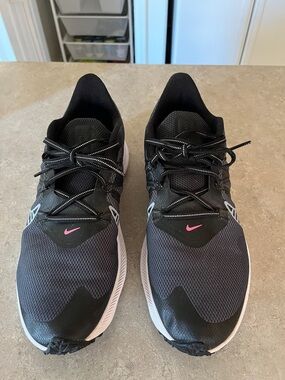 Nike Black Shoes with Pink Swoosh Accent